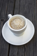 Cozy background for a cafe. Black coffee. Light snack. Favorite morning coffee. Fast breakfast. Wooden table. Aromatic drink. Restaurant theme. Morning meal. Best coffee.