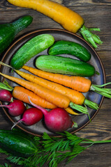 Summer harvest and fresh vegetables radish cucumber and carrot. Healthy food and diet concept