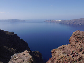 Fototapeta na wymiar Panoramic view of mountains, sea and nature from Fira town, Santorini island Greece. View of the caldera and ships in the bay.