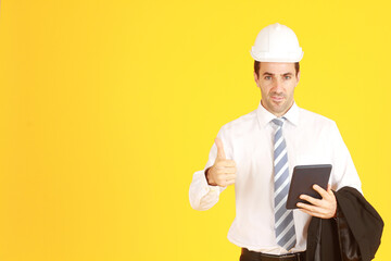 Handsome and smart businessman white shirt hand holding smartphone smiling and Thumbs up isolated on yellow background. Copy Space