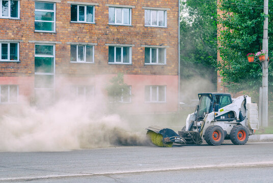 Improper cleaning of the road with a special machine. Very dusty and dirty