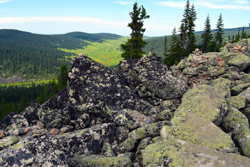 The top of a high mountain. Independent tourism. A sense of freedom and happiness.Mountain valley....