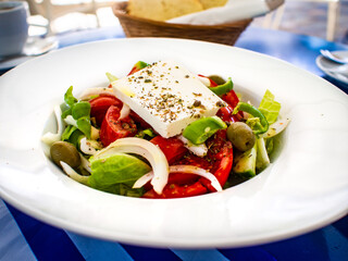 Fresh Greek salad - feta cheese, cherry tomatoes, lettuce, black olives and onion