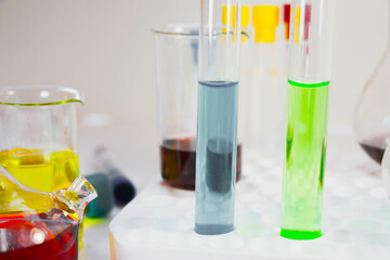 Laboratory chemical liquid elements and research diagnoses, instruments and objects in the sterile table, glassware