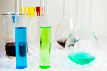 Laboratory chemical liquid elements and research diagnoses, instruments and objects in the sterile table, glassware