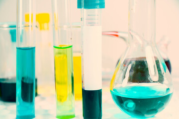 Blood test tube sample without name, empty space for text, laboratory background