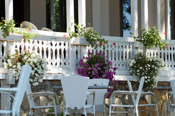 white terrace in Provence style with flower pots