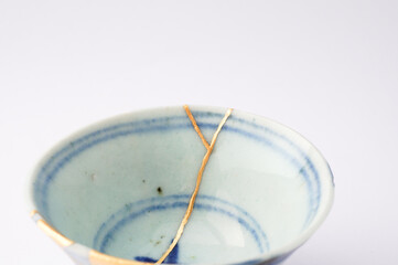 Antique Japanese kintsugi sake cup. Handmade ceramic restored with the ancient traditional Japanese technique.