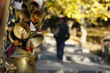 A bunch of copper bells hanging for prayer offering in the premises of Muktinath Temple in Mustang...