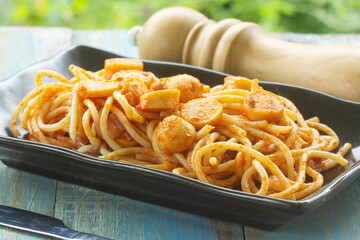 Spaghetti with fried sausage