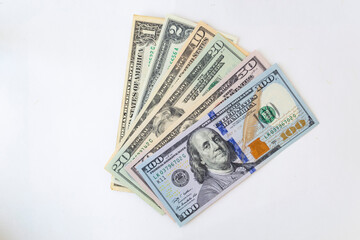 Stack of money American dollar bills on a white background. The concept of buying for dollars