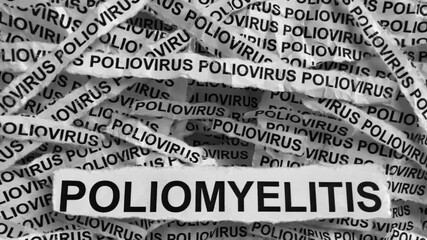 Strips of newspaper with the words Poliomyelitis and Poliovirus typed on them. Black and white. Close up.