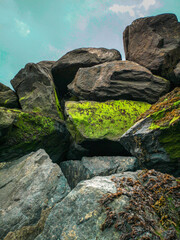 dark natural rocks, some with moss