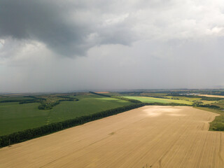 Fototapeta na wymiar Aerila drone view. Summer rain over agricultural fields in Ukraine.