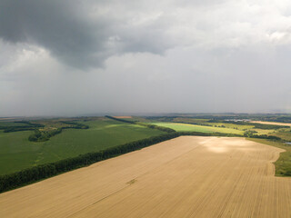 Aerila drone view. Summer rain over agricultural fields in Ukraine.