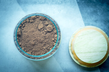Dark cocoa powder in glass jar