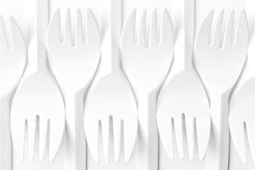 Close-up of plastic Forks. Flat lay pattern.