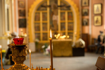The interior of the Russian Christian church. Candles and icons during the service. Chesme church in the city of St. Petersburg, Russia. Image with selective focus.