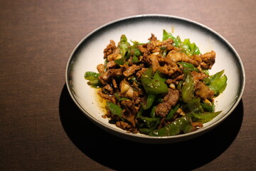 a plate of Stir fried meat with chili on table. famous Chinese food