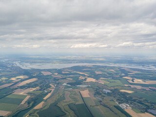 Rain clouds over agricultural fields in Ukraine, aerial view.