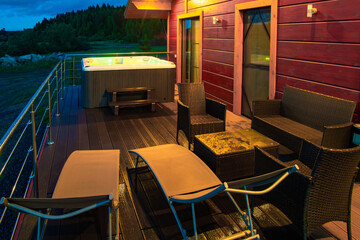 Rest by countryside. Terrace of house offers a good view. Outdoor chaise lounges. Bath is set on terrace. Minnie pool with hydromassage. Rural vacation villa. Northern nature. Night spa treatments