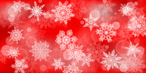 Christmas background of blurry snowflakes in red colors
