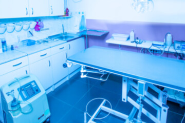 Veterinary office. Blurred veterinary background. Equipment in the office of a veterinarian. Clinic of the veterinarian. Cabinet for medical assistance to animals. Couch for viewing animals