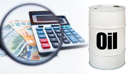 Analysis of the oil industry. Money under a magnifying glass. A calculator next to crude oil. The inscription on the barrel. Analysis of oil futures. Concept - commodity exchange trading. Naphtha