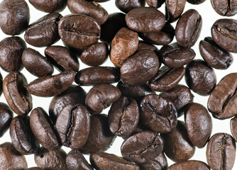 Coffee grains on white background