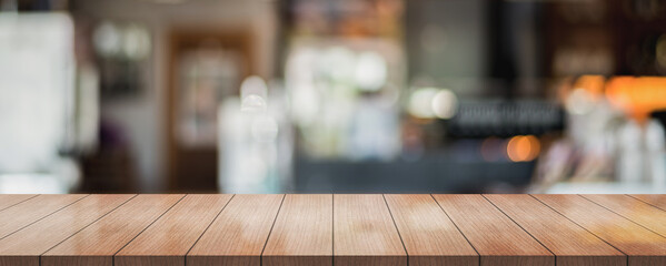 Empty wooden top table with on blur panoramic restaurant background, banner background, panoramic background