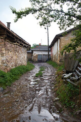 Fototapeta na wymiar Old traditional village in Stara Planina mountains on a rainy summer day 