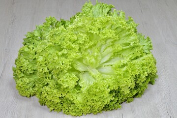 isolated head of fresh lettuce close up
