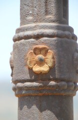 old stone statue with flower