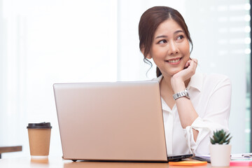 Business asian woman happy working job on laptop in office.