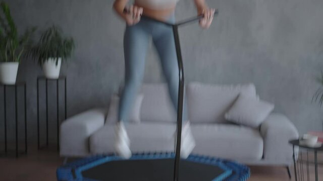 Training with music: the athlete vigorously jumps, having fun
