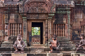 statues of human figures with animal heads in Banteay Srei temple in  the area of Angkor, Cambodia