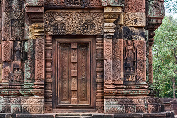 Fototapeta na wymiar Blind door and balusters Banteay Srei temple in Angkor, Siem Reap, CambodiaBlind door and balusters Banteay Srei temple in Angkor, Siem Reap, Cambodia