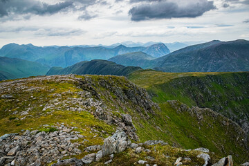 Mountain landscape in Scottish Highlands. View from the top of Stob Ghabhar in Scottish Highlands towards Glen Coe with Ben Nevis on the horizon.