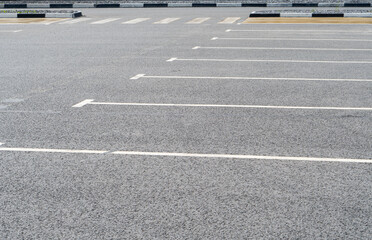 Empty car parking near shopping mall. Modern parking lot. Carpark. Empty parking spaces at the shopping center. Public carpark. Outdoor parking.