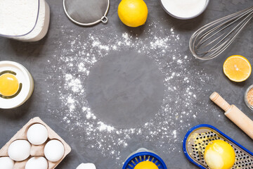 Top view raw ingredients for cooking lemon pie on wooden background with copy space. Bakery background.