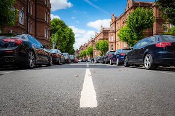 Attractive residential street of large terraced houses in Kensington & Chelsea borough of London 
