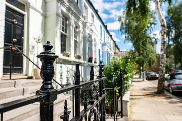 Attractive residential street of large terraced houses in Kensington & Chelsea borough of London 

