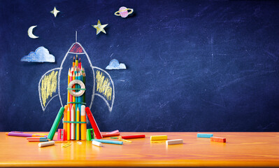 Startup Concept - Rocket Sketch On Blackboard With Colorful Pencils - Back To School