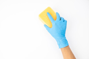 Sponge and spray for cleaning in female hand. Hand in a latex glove isolated on white. A hand in a glove holds a sponge and spray  cleaning.