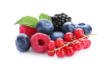 Pile of different ripe tasty berries with green leaves isolated on white