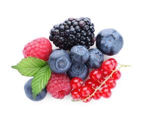Pile of different ripe tasty berries with green leaves isolated on white, top view