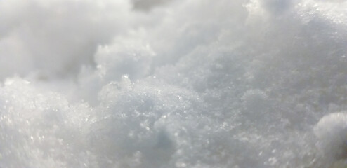 Close-up shot of ice formed inside the freezer resembling white snow mass - abstract concept.