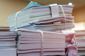 Bunch of education documents or report teacher after approve and checking from admistrator, Annual Reports document for evaluation in student study in university office