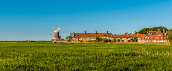 A view across the marshes of the village of Cley, Norfolk, UK