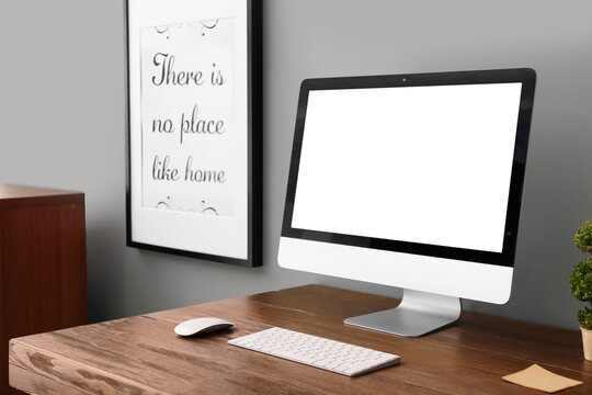 Home workplace with modern computer and desk in room. Mockup for design